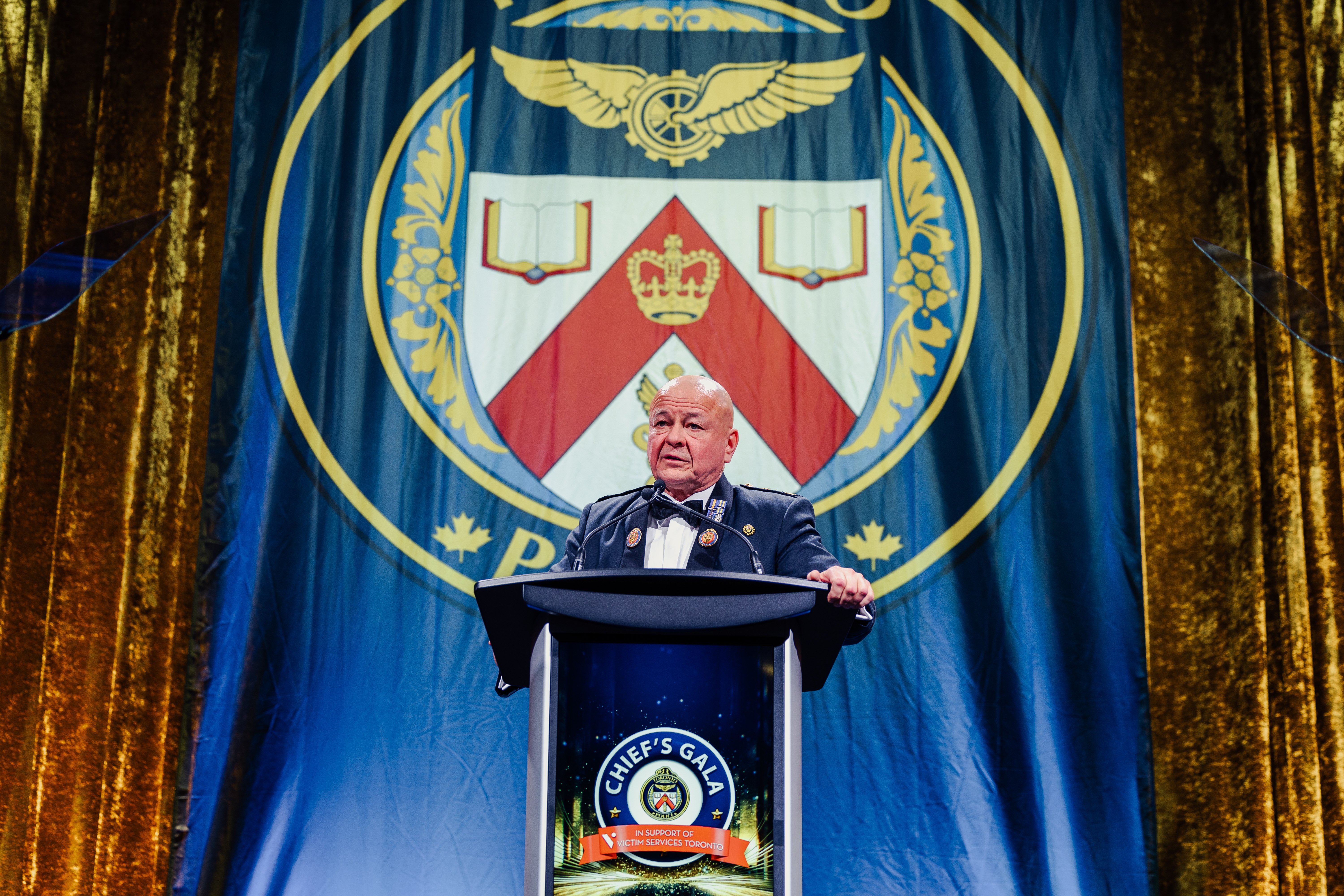 A police officer speaks at a podium
