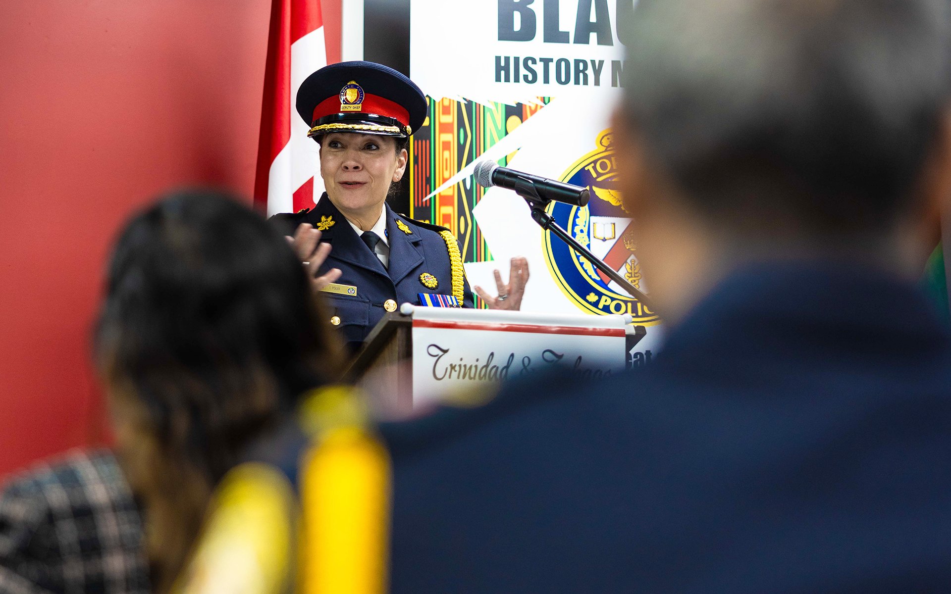 police officer speaking at a podium