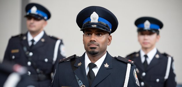 People at attention in uniform