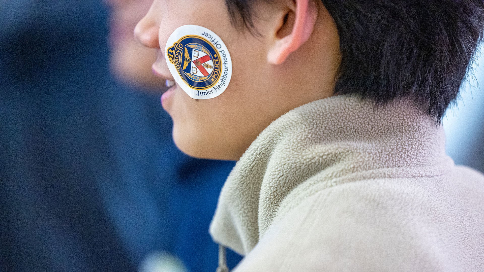 Person with TPS sticker on their face