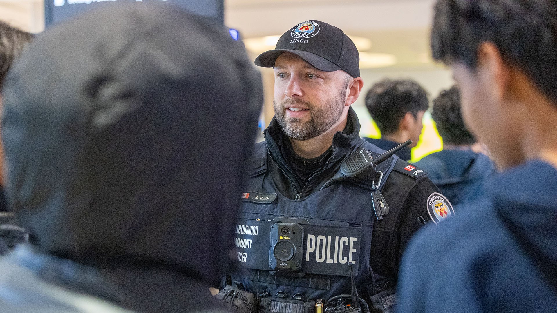 Police officers speaks to people