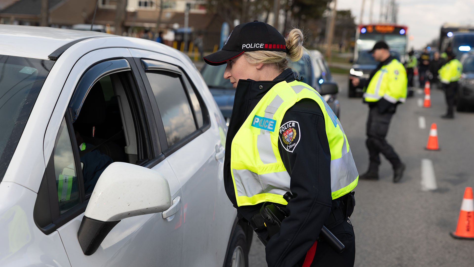 Police ofifcer at a car window
