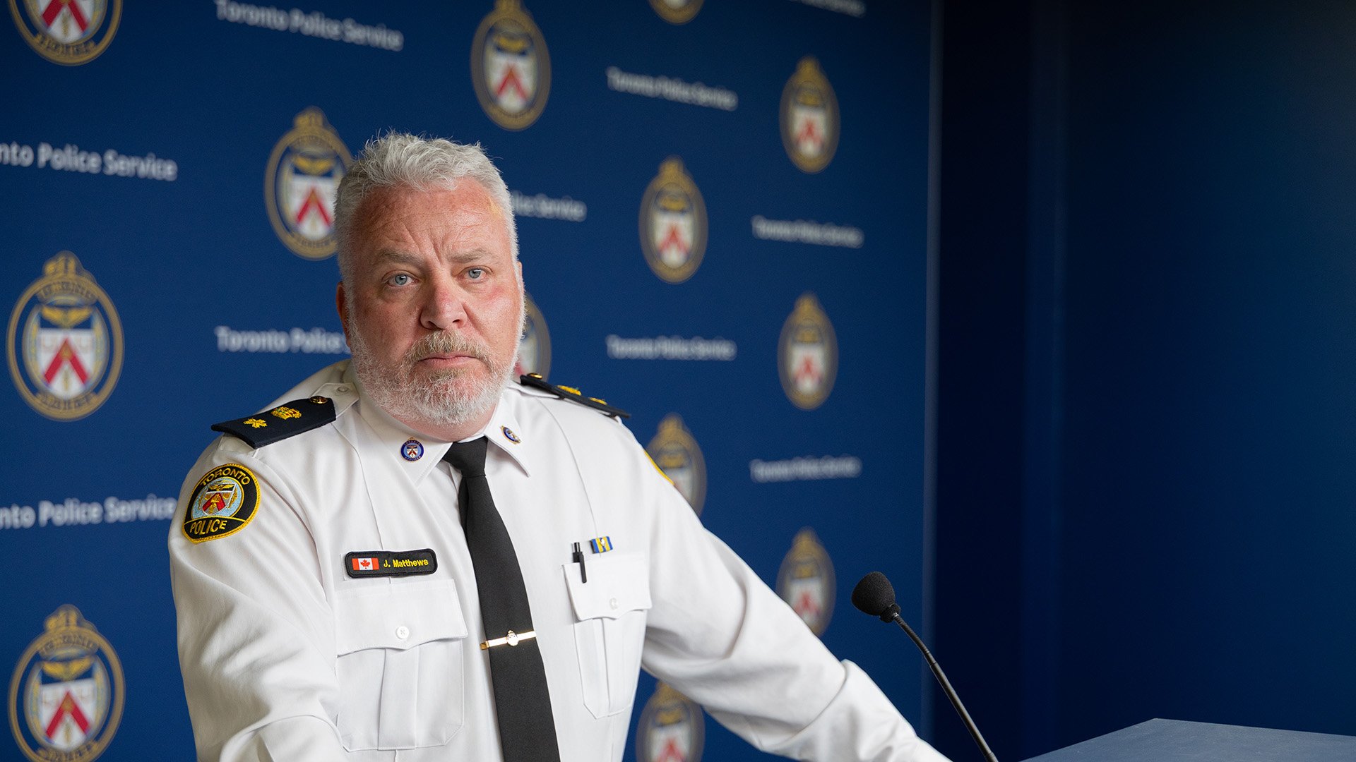 Police officer at a microphone