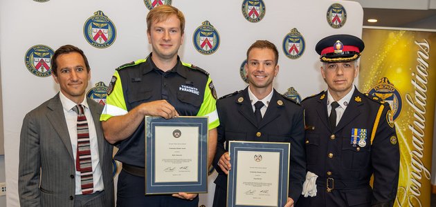 Group of people holding certificates