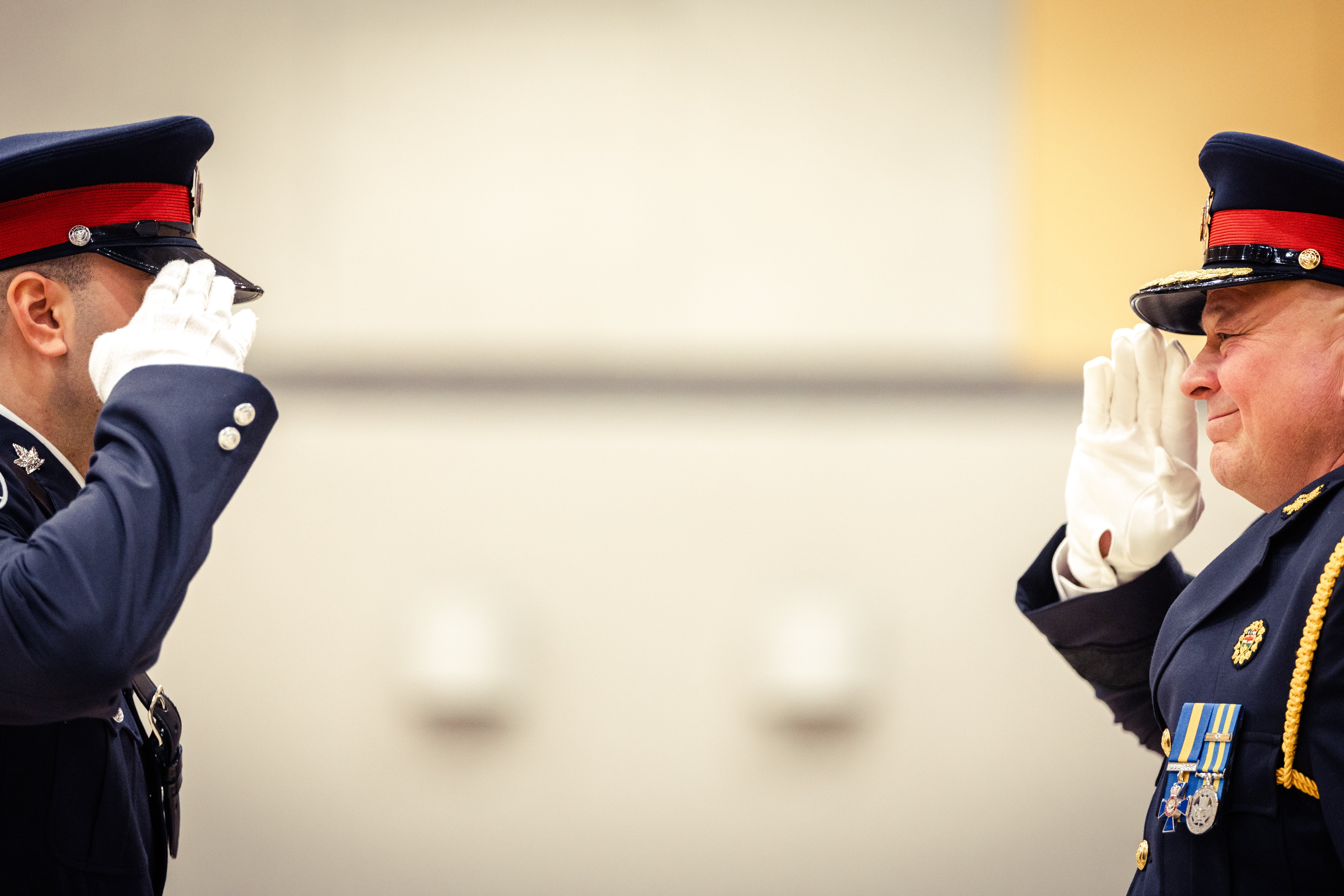 Two police officers salute each other