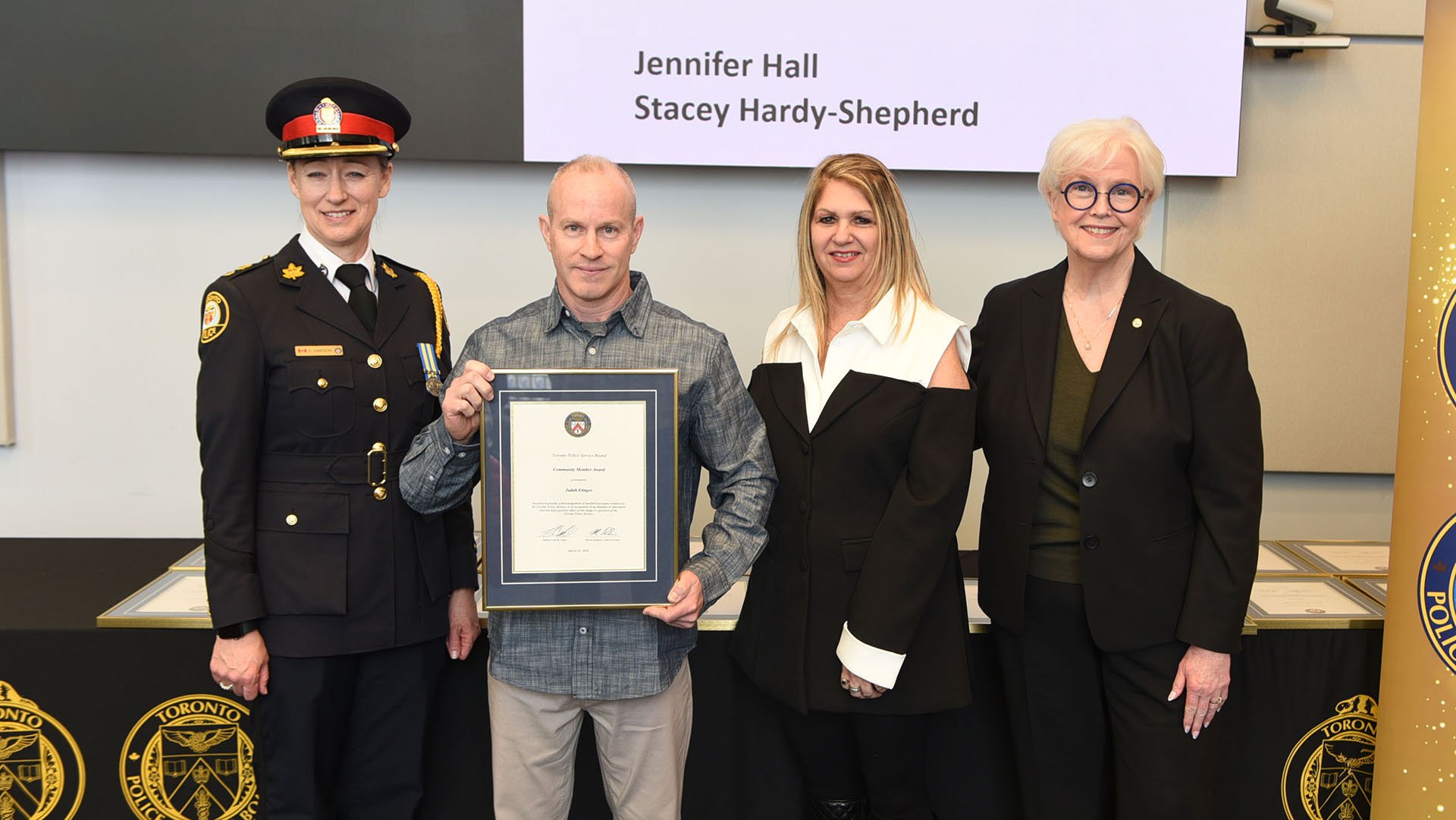Group of people standing with certificate