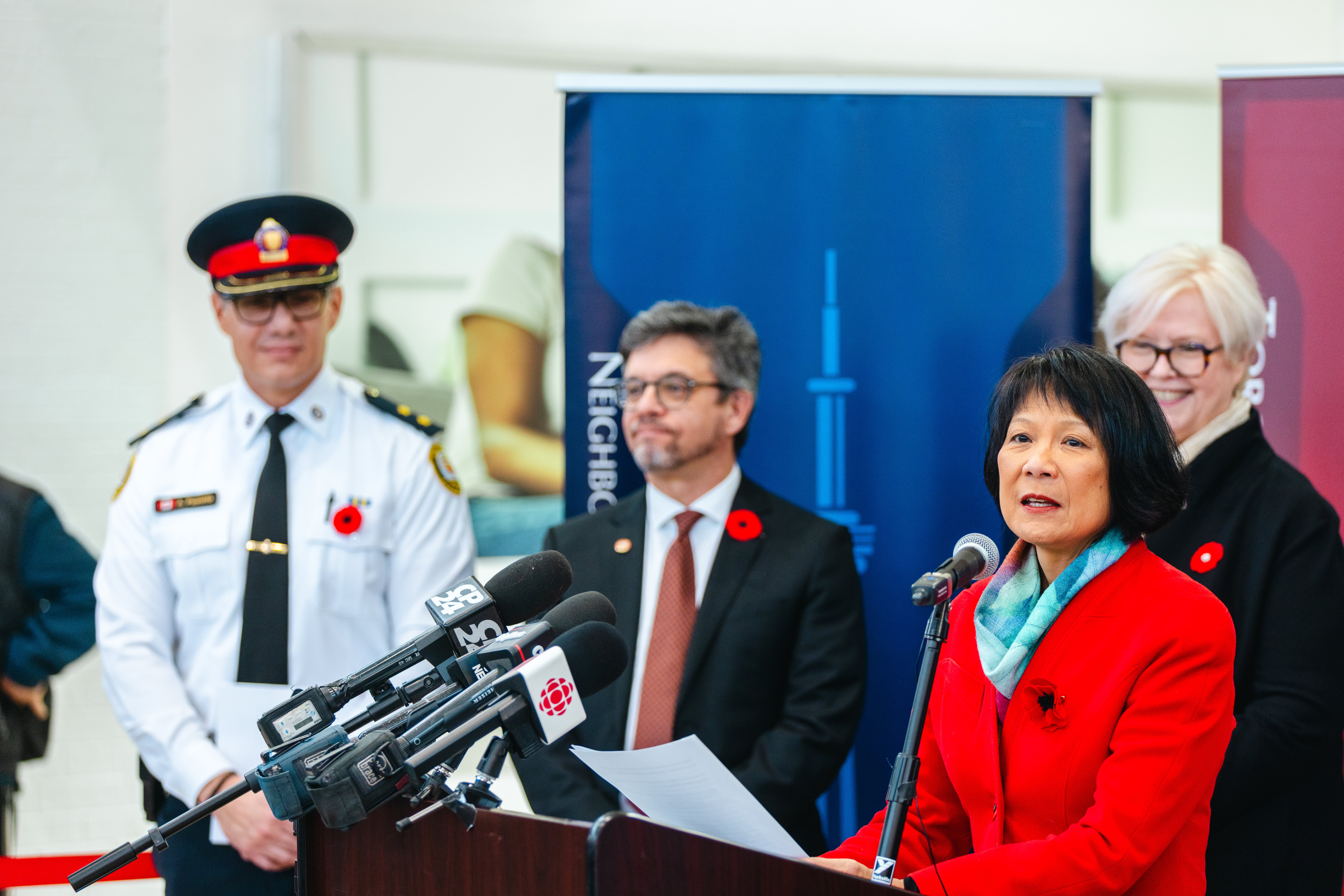 A woman speaks into a microphone