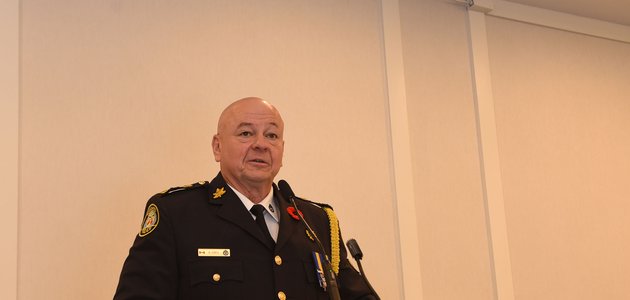 Police officer at a podium