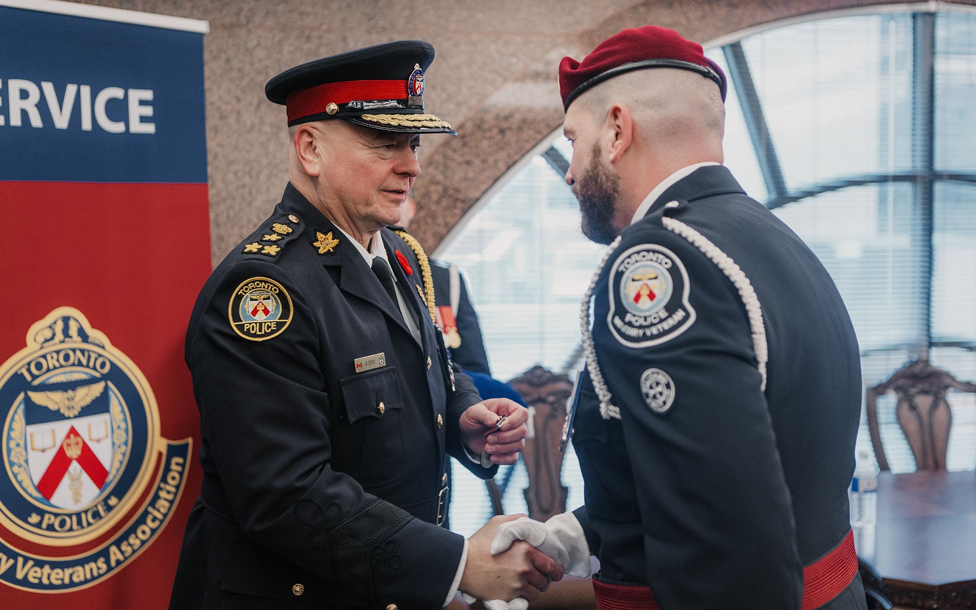 Two police officers shaking hands