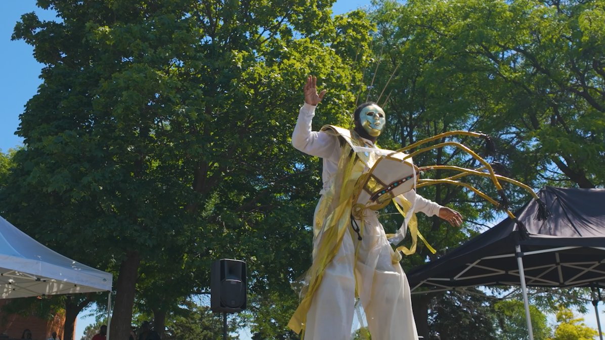 Costumed person on stilts