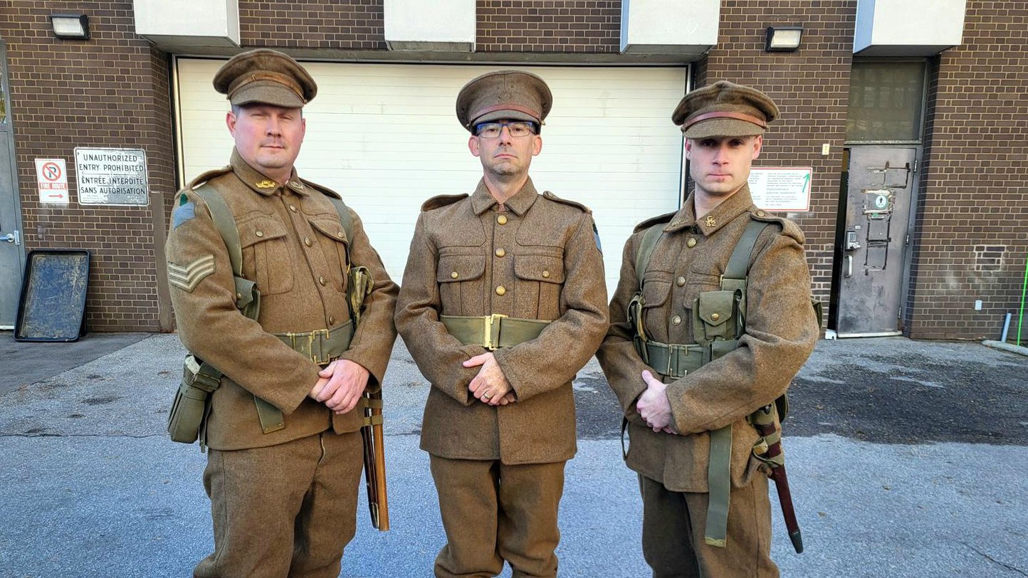 Three people in military unfiorm