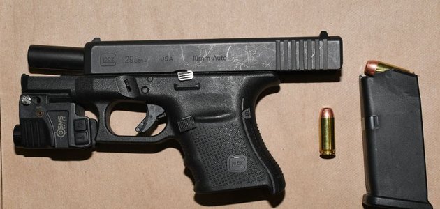 Gun and magazine on table
