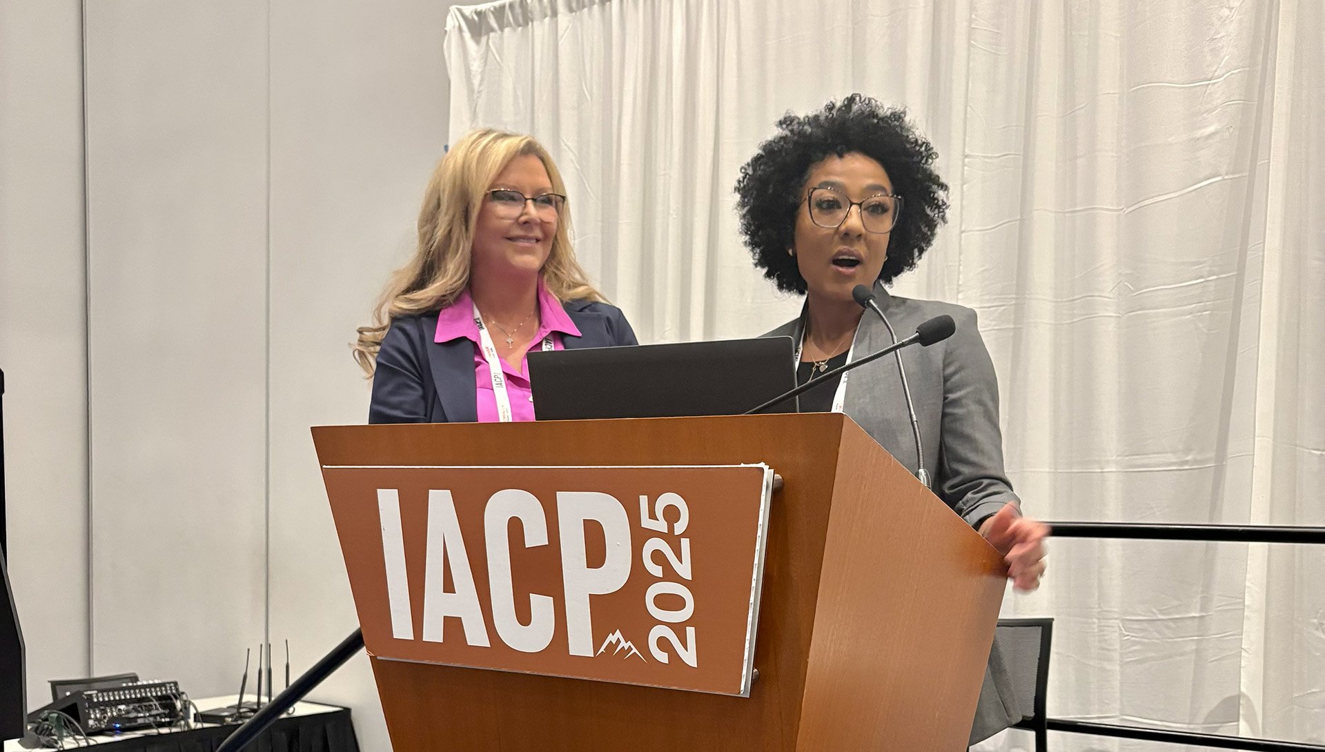 Two people at a podium