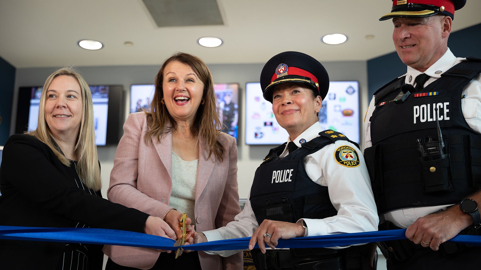 People cutting a ribbon