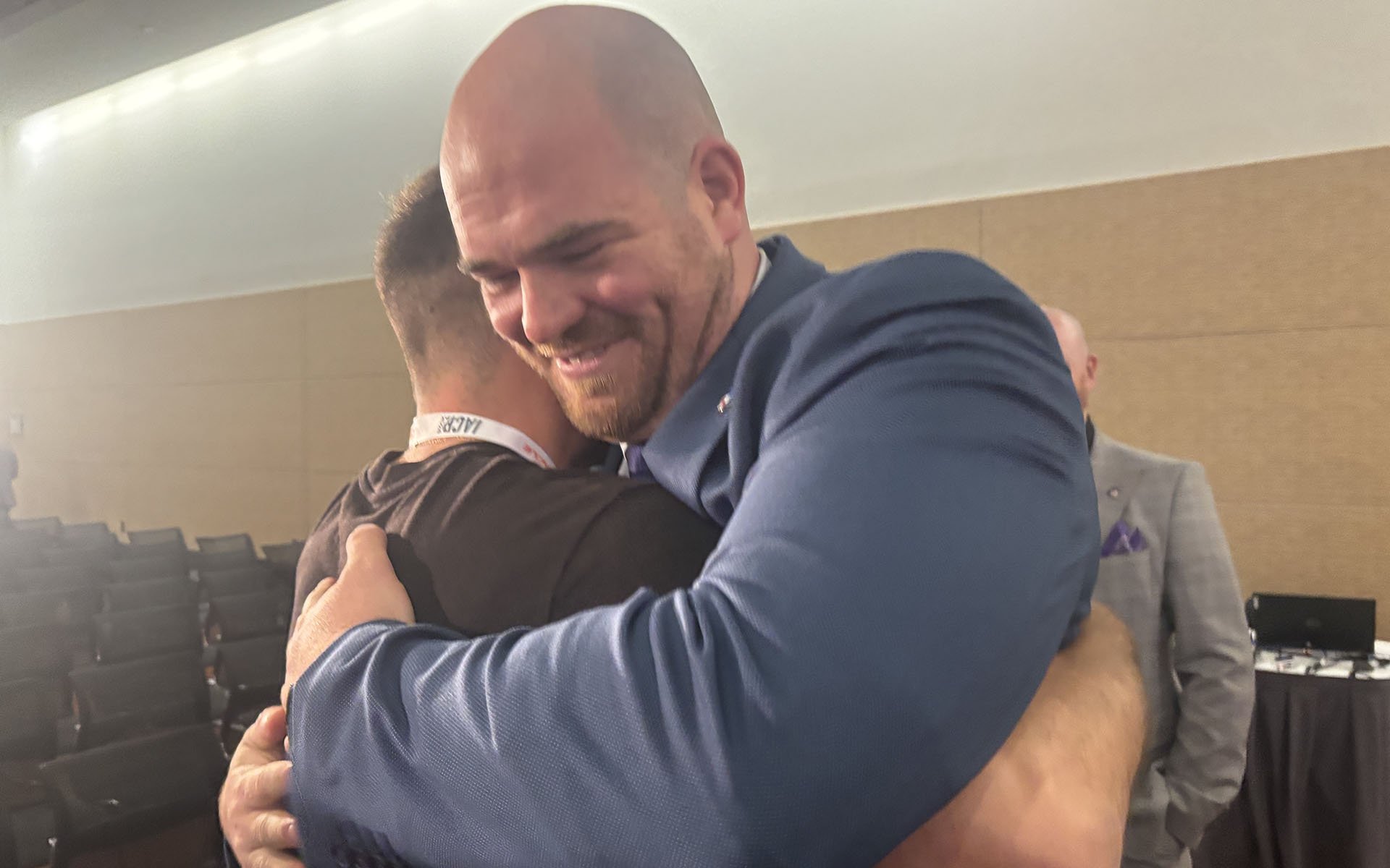 Two people hug