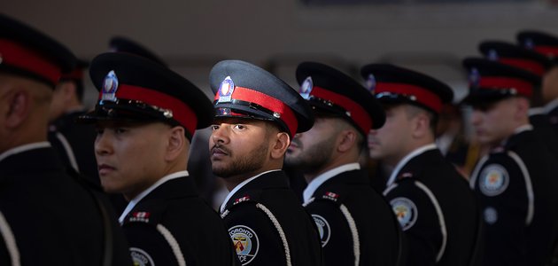 A group of police officers lined up