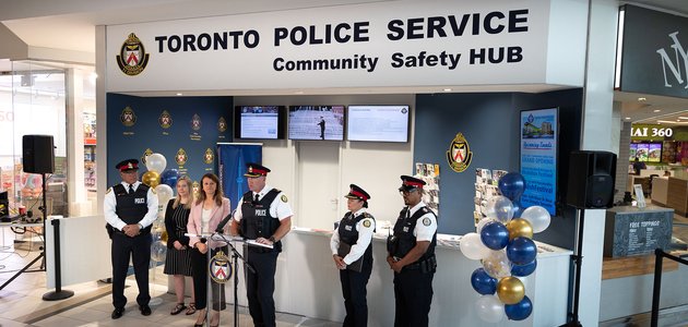 Police officer at a microphone