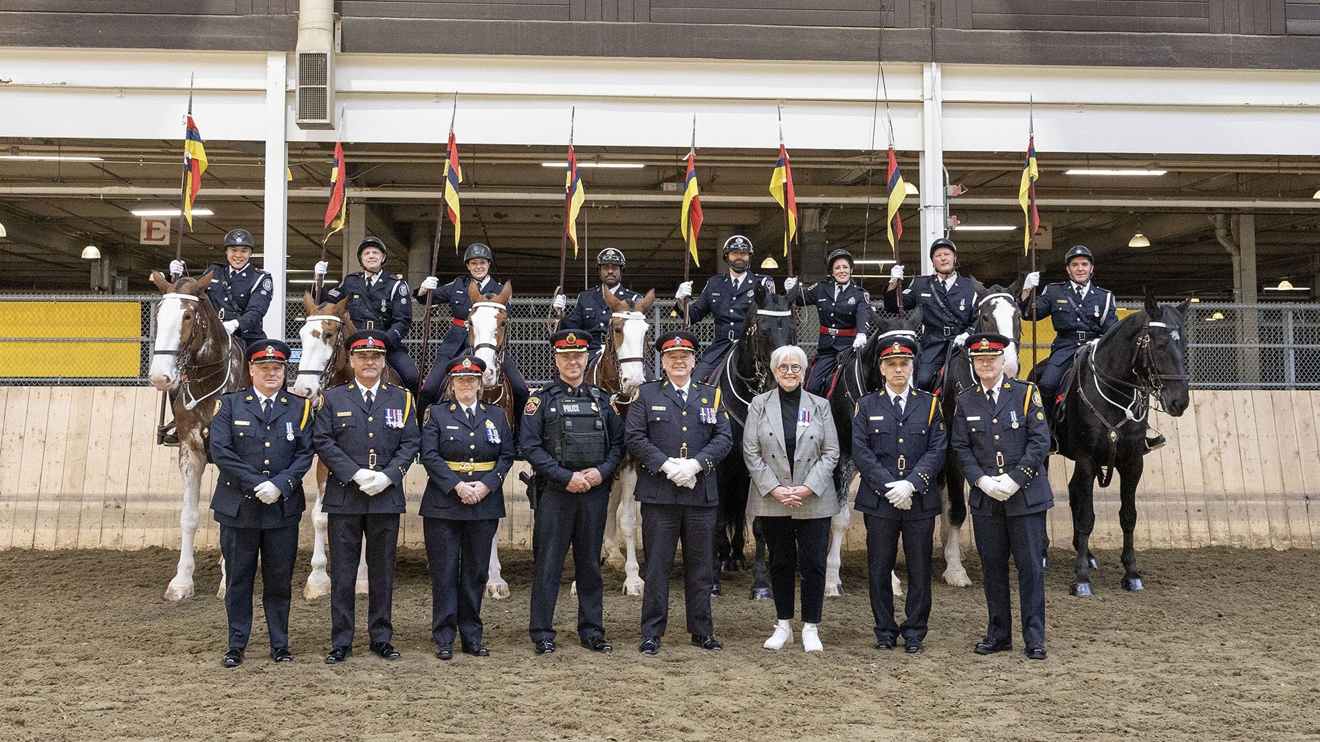 Group of people with mounted officers