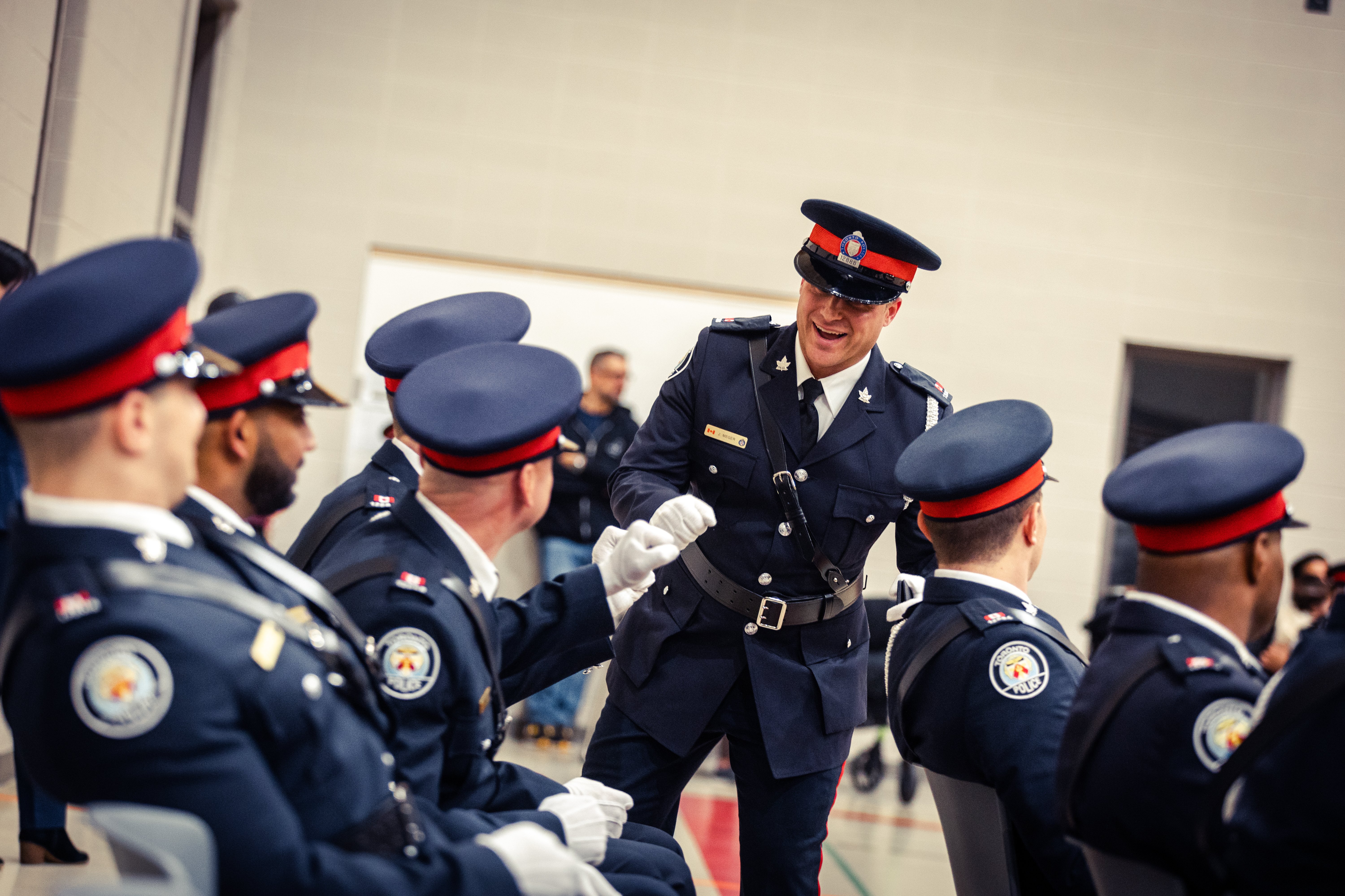 A police officer fist bumps another police officer