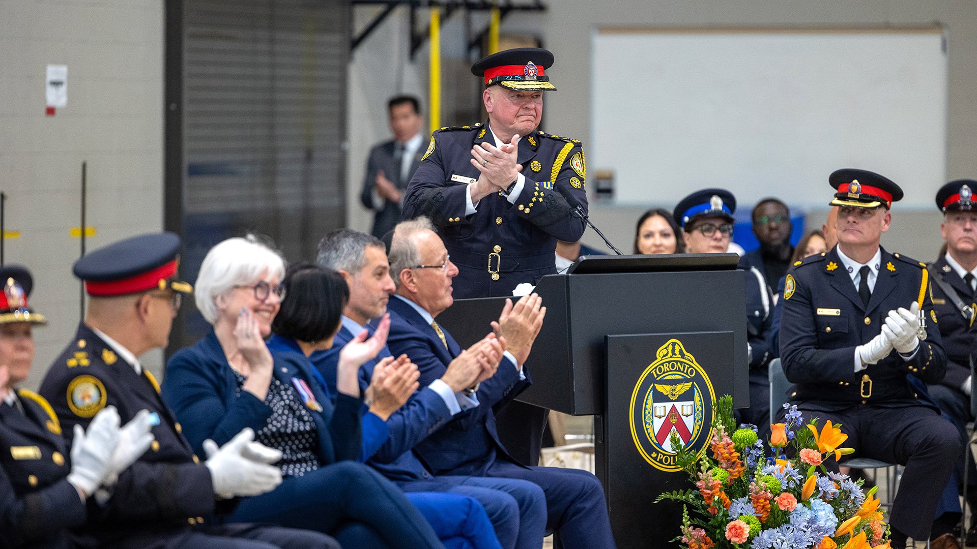 Police officer and audience clapping