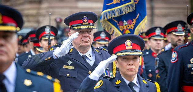 Police officers saluting