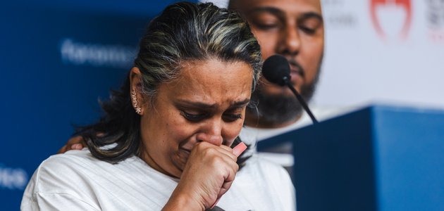 Woman with a balled fist crying