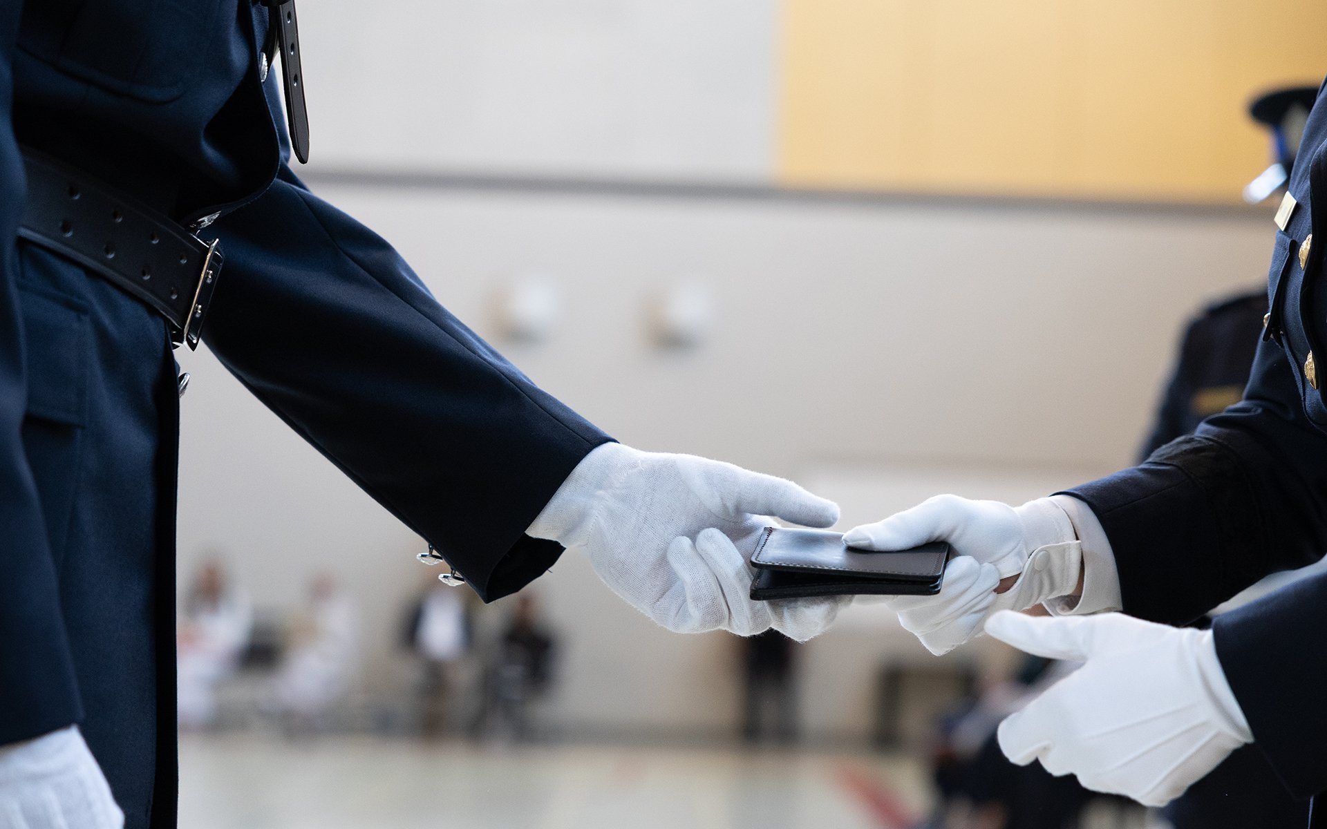 Badge being handed to a person