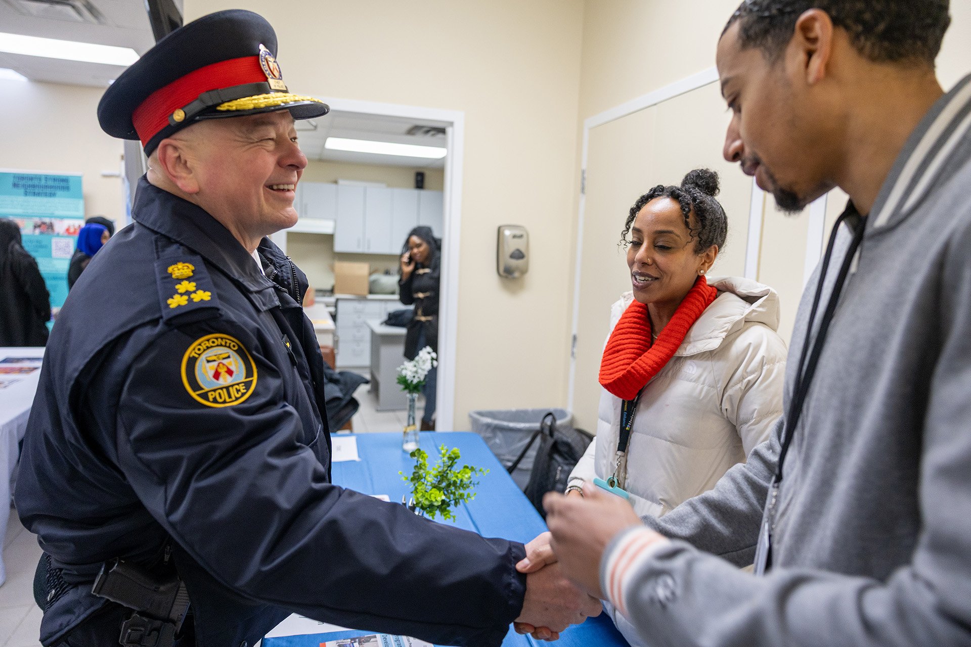 Police officer shaking hands with a person