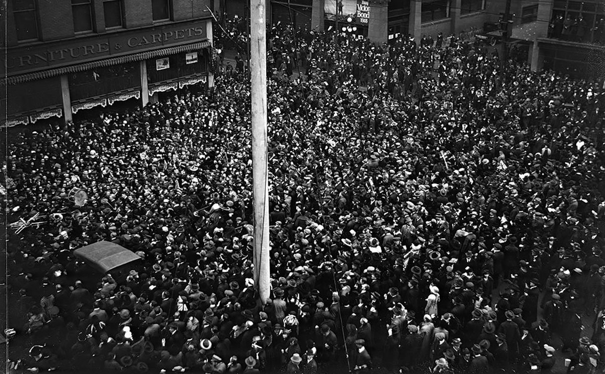 A large group of people fill a street