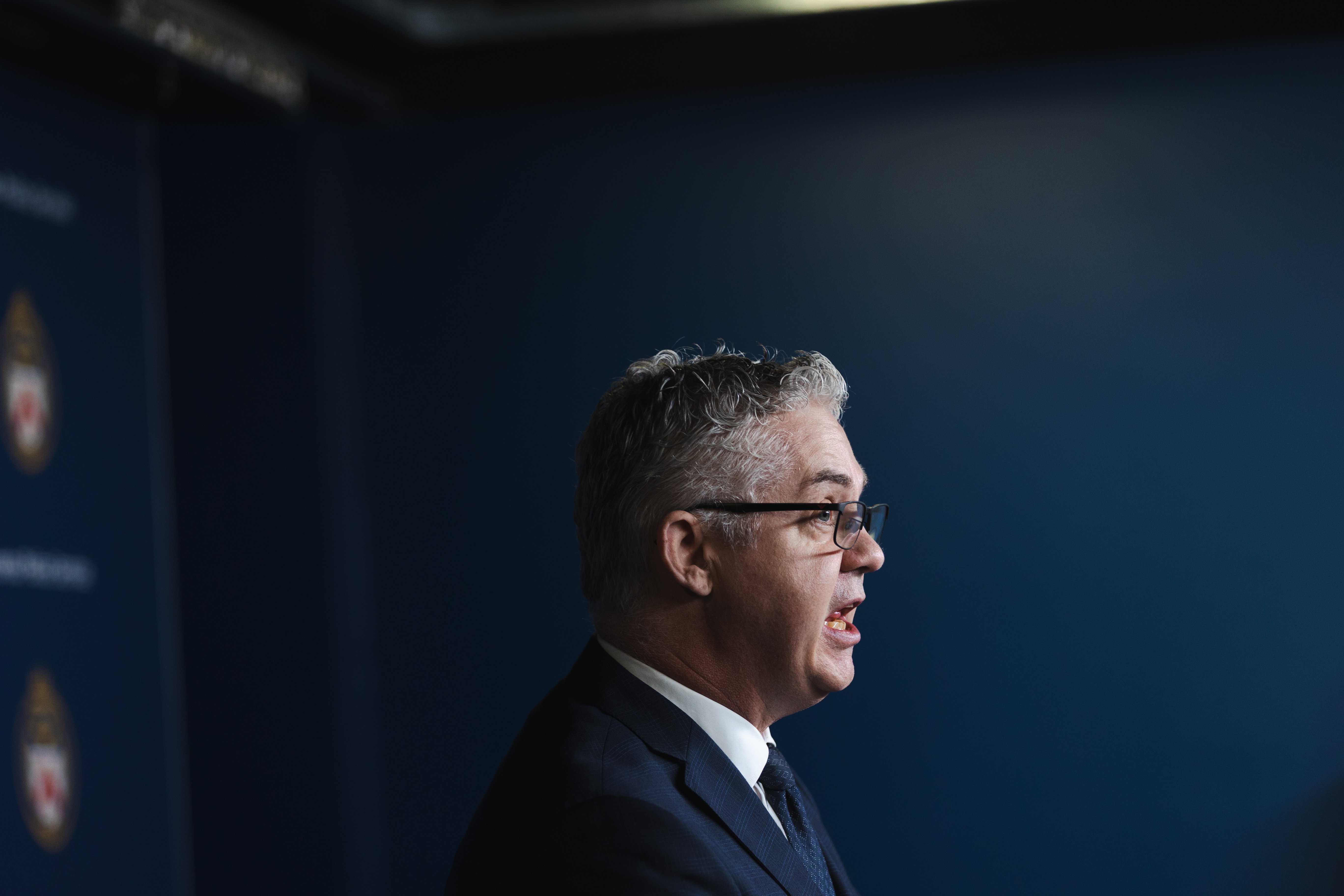 A man in a suit speaks