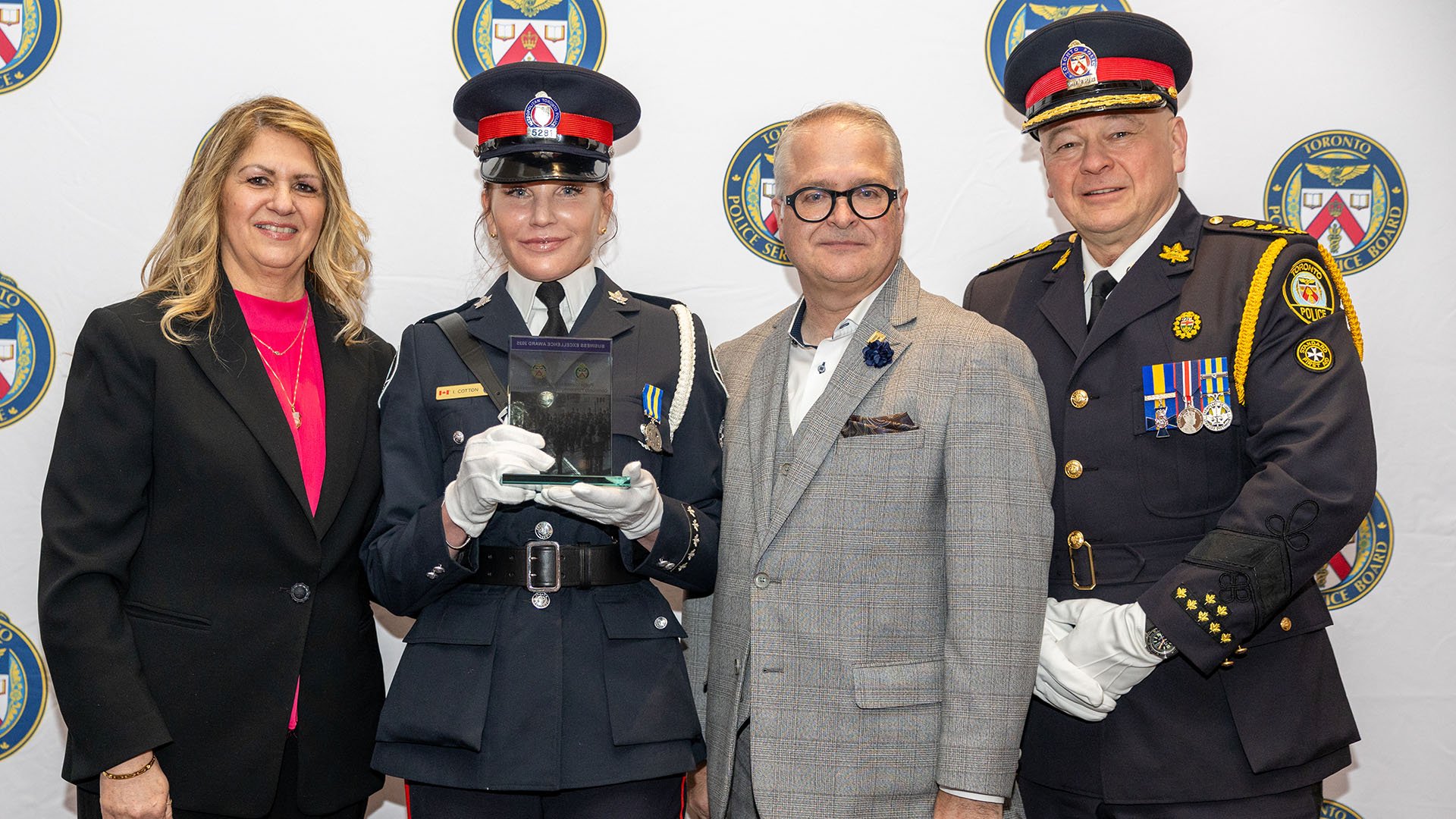 TPSB member Lisa Kostakis, Constable Isabelle Cotton, Chris Worth and Chief Myron Demkiw