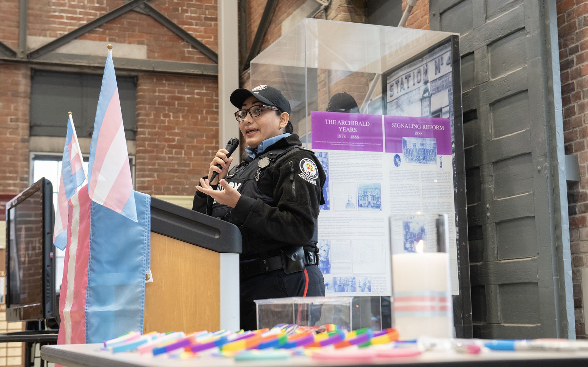 Person in TPS uniform at a podium