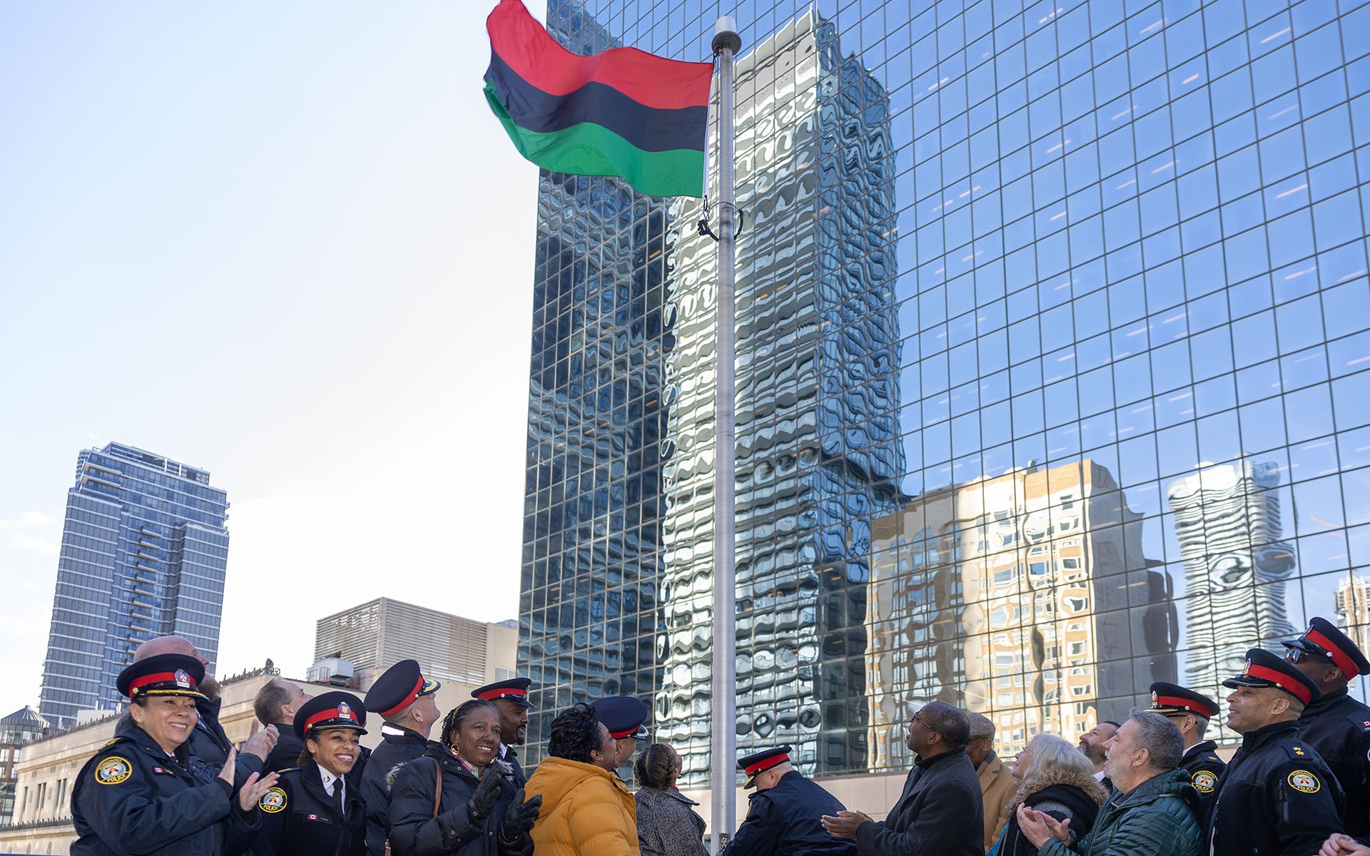 Group of peole under a flag