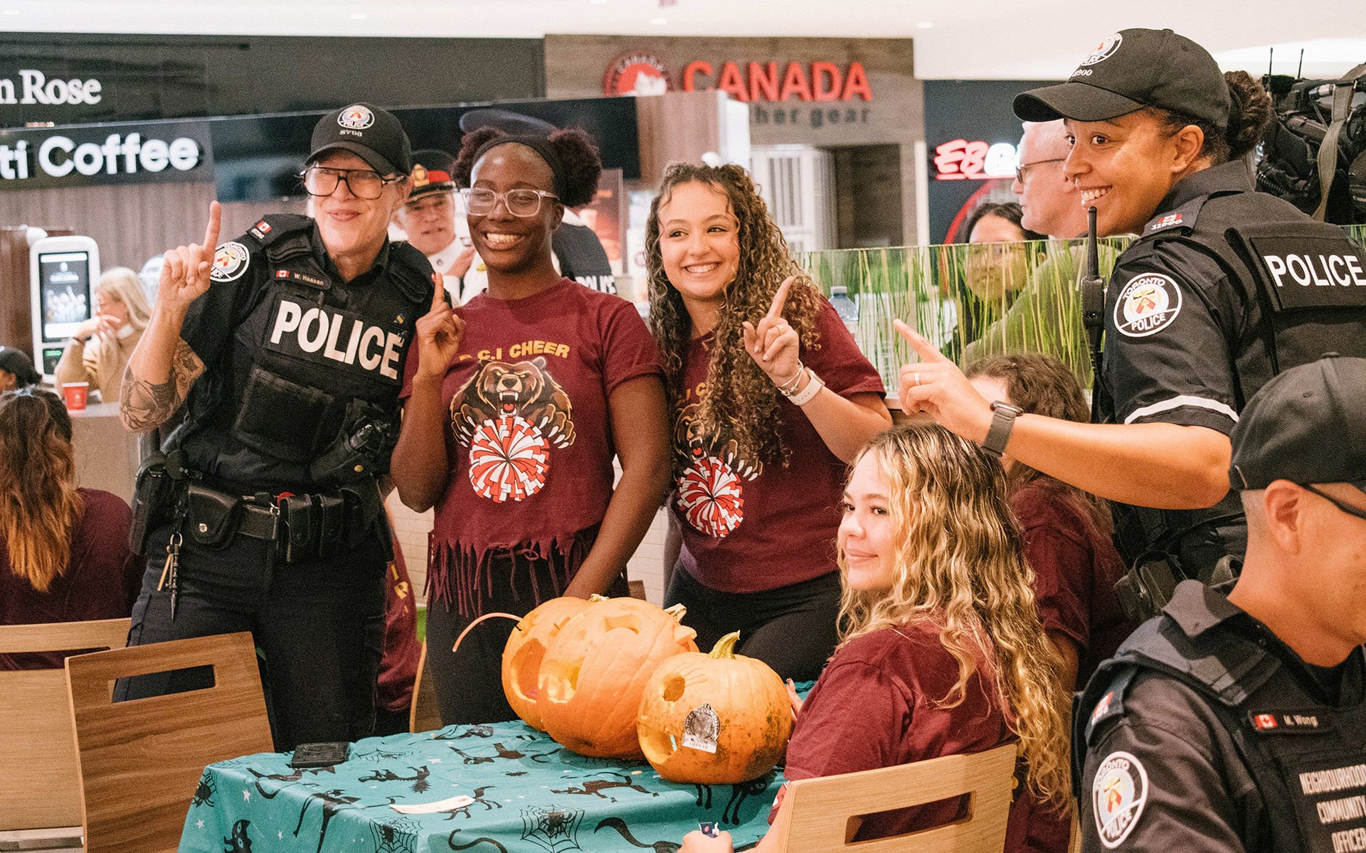 Police officers and young people with pumpkins
