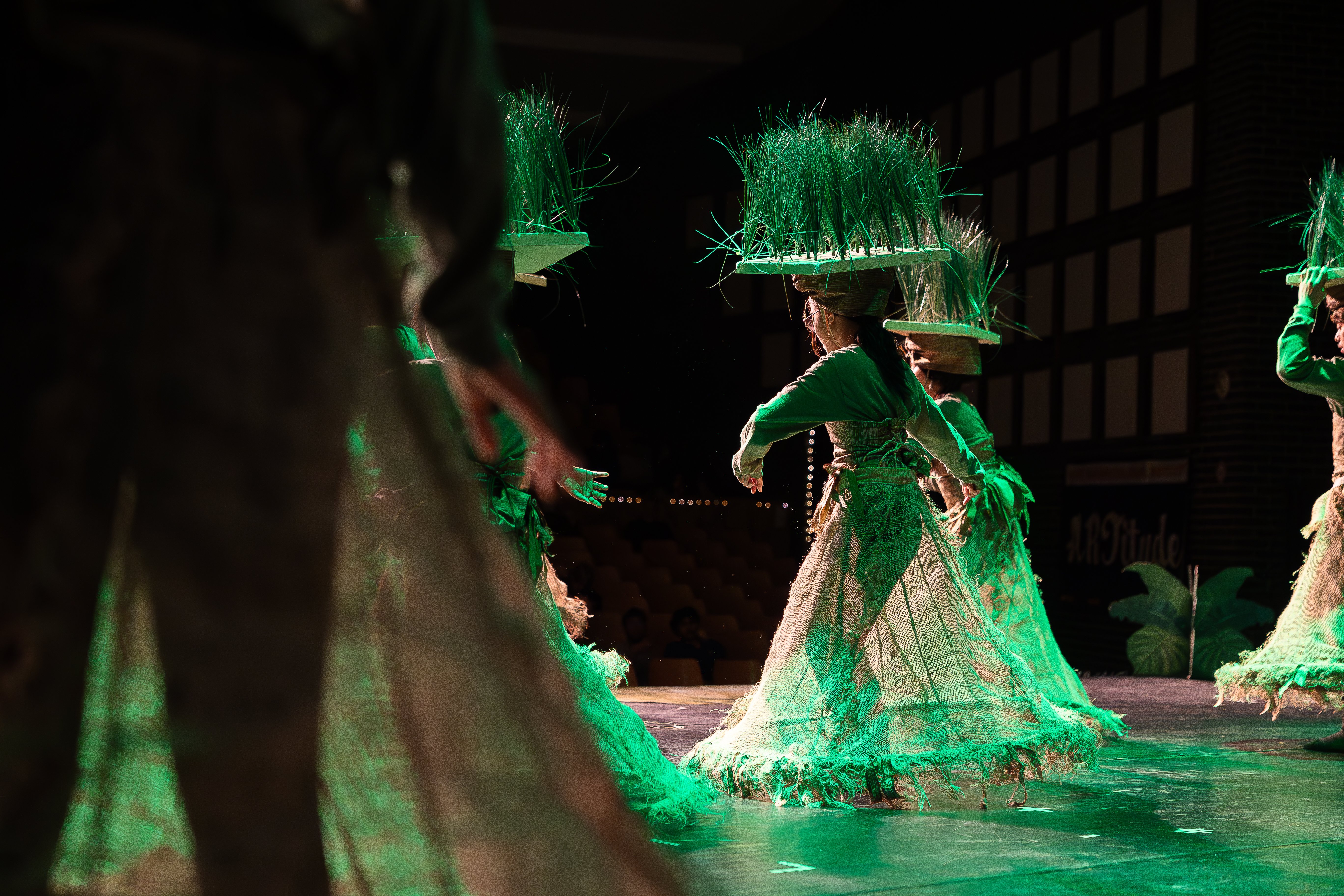 People in costume on stage