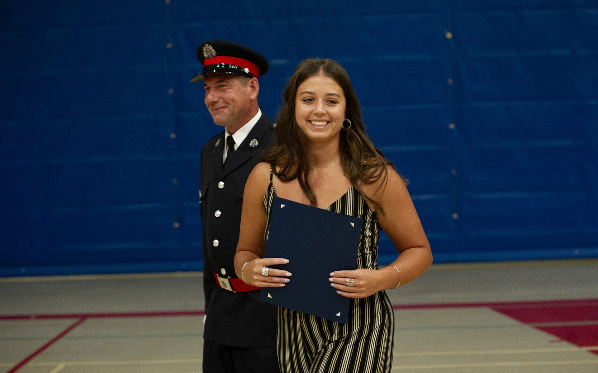 Person standing with police officer