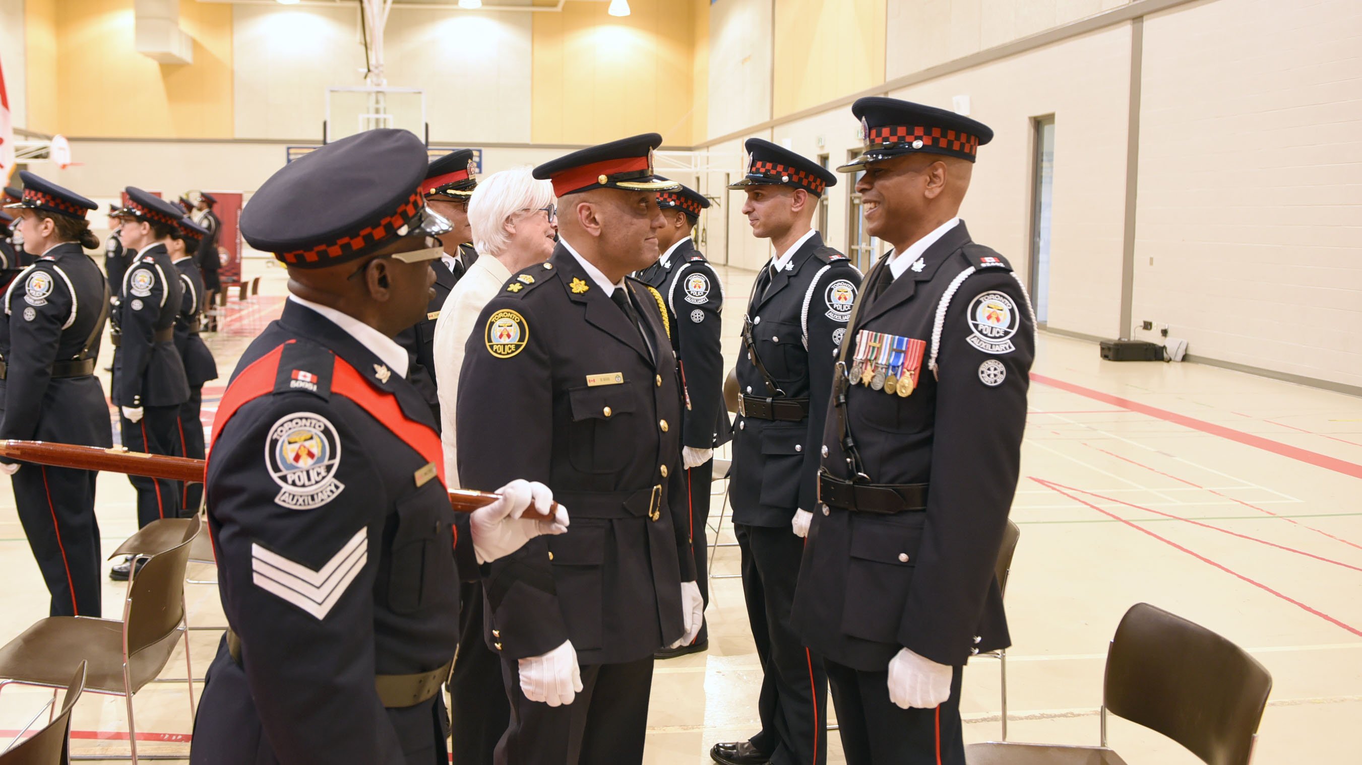 People in uniform stand together