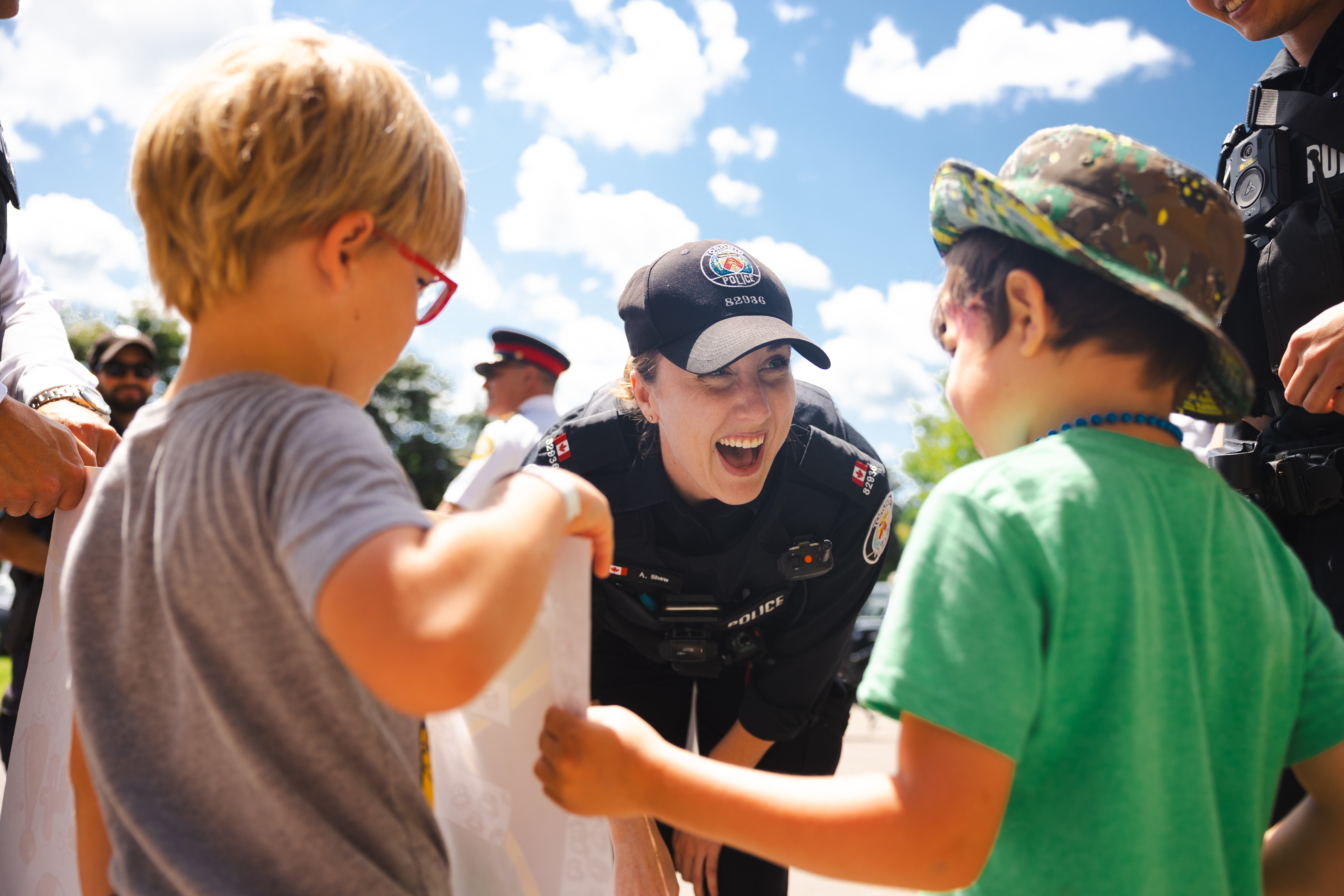 Police Officer talks to children at the Carnival kick-off