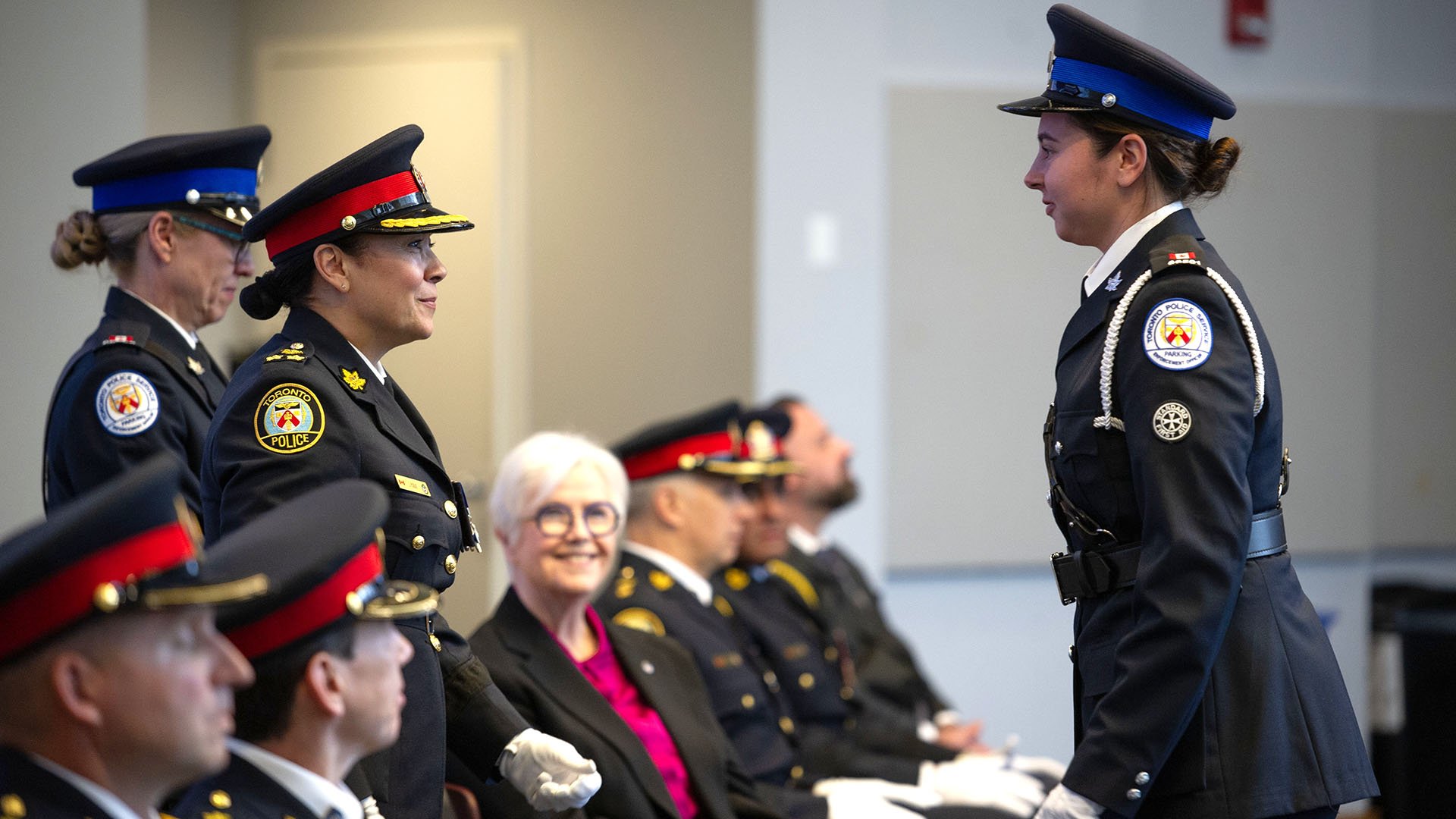Two people in uniform stand together