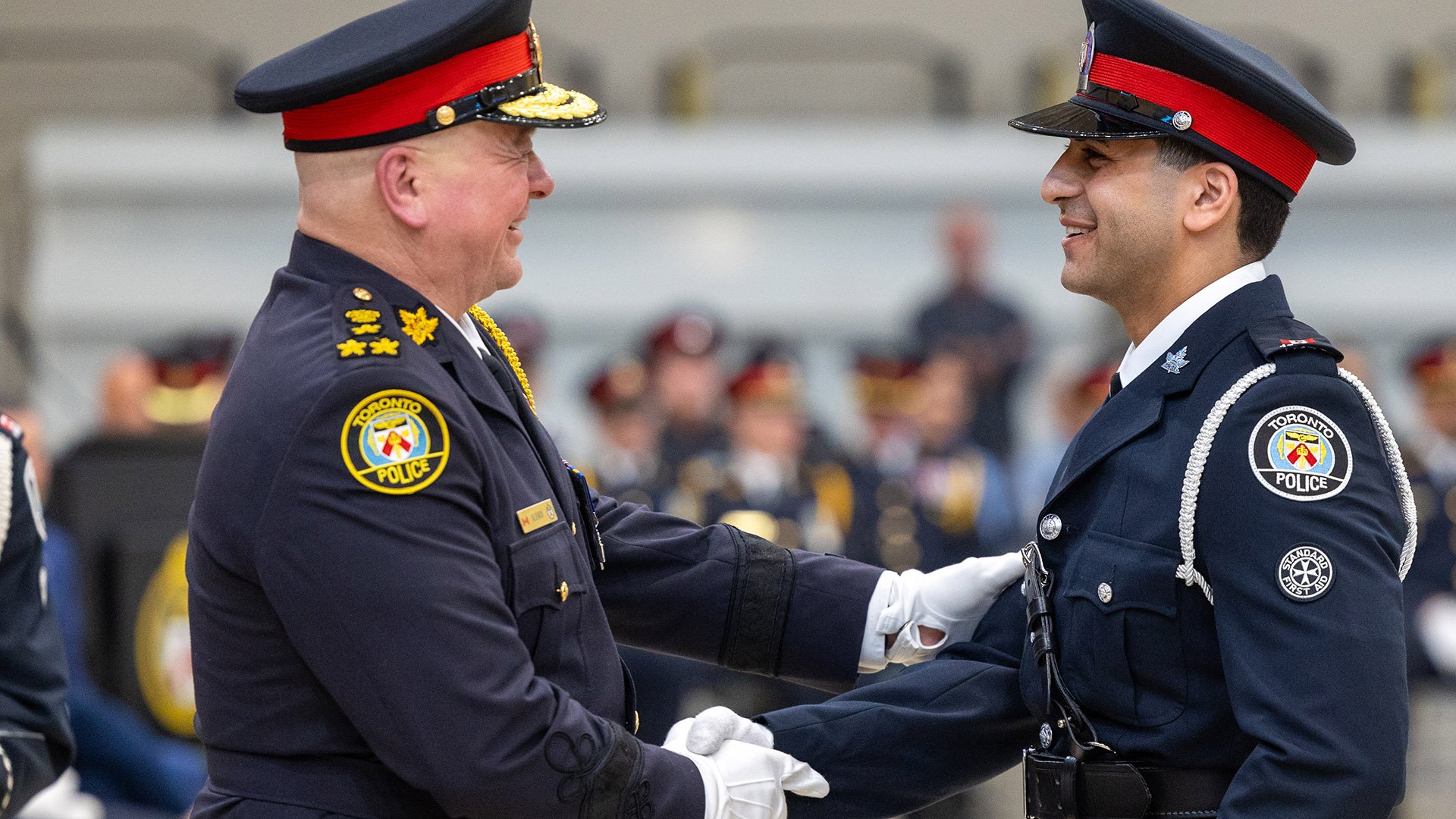 Two police officers shake hands