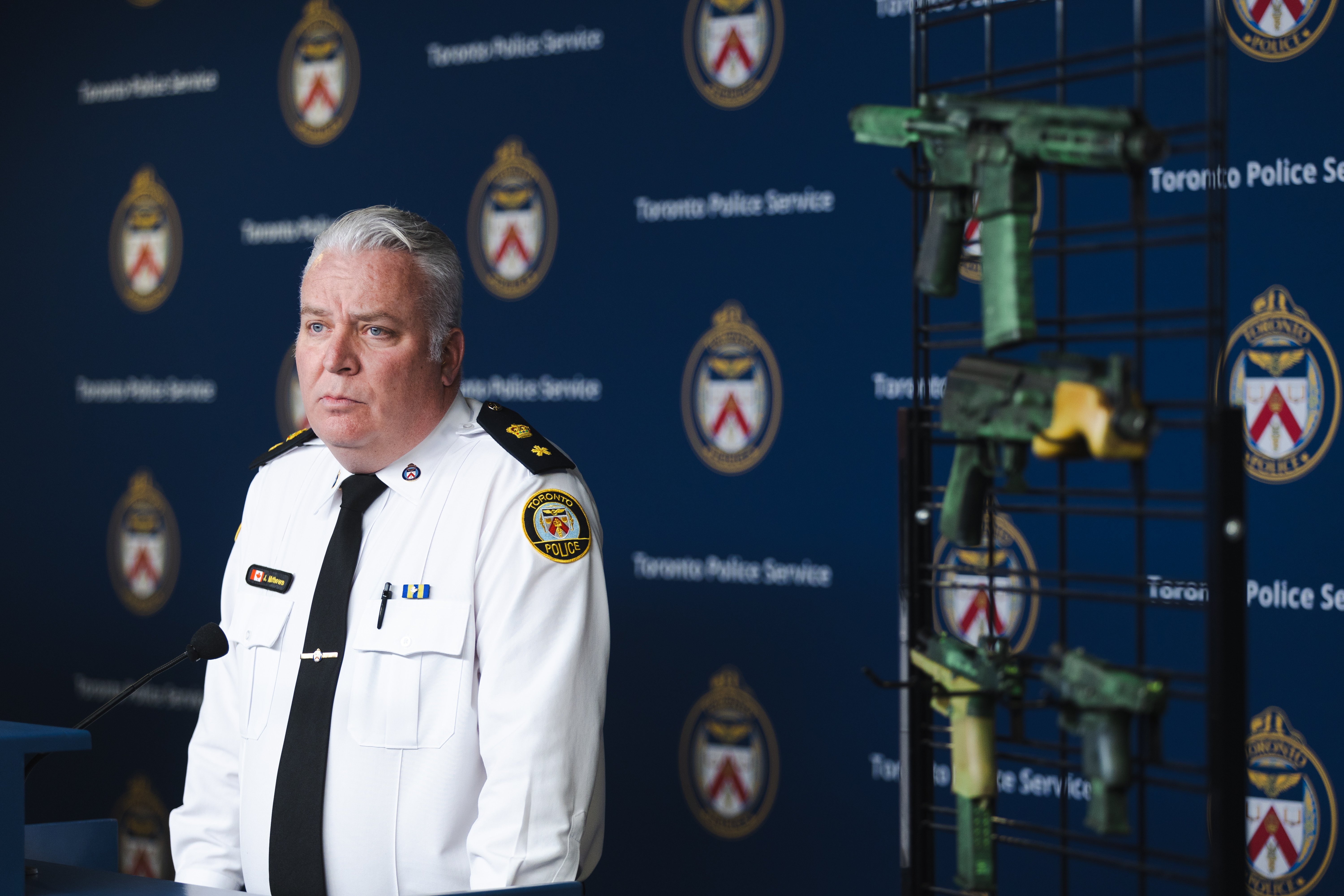 A police officer speaks to the media