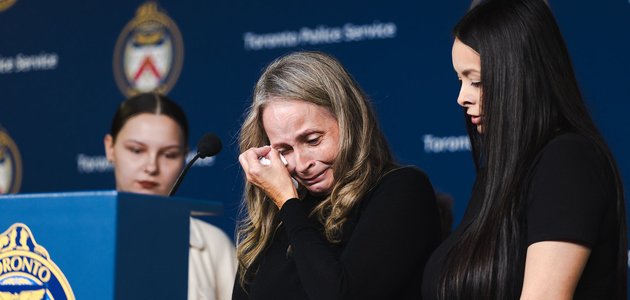 Woman at podium crying