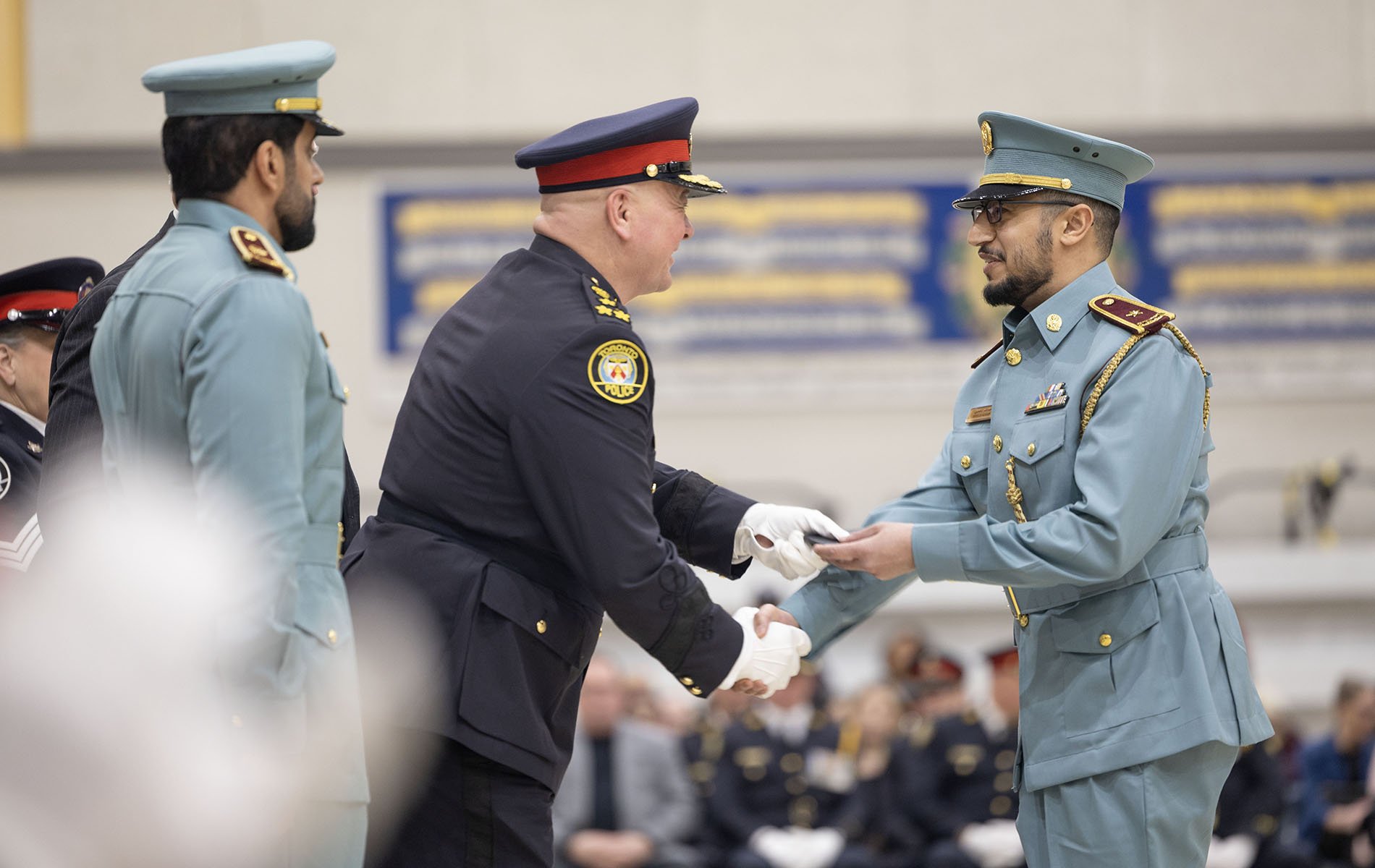 Two police shake hands