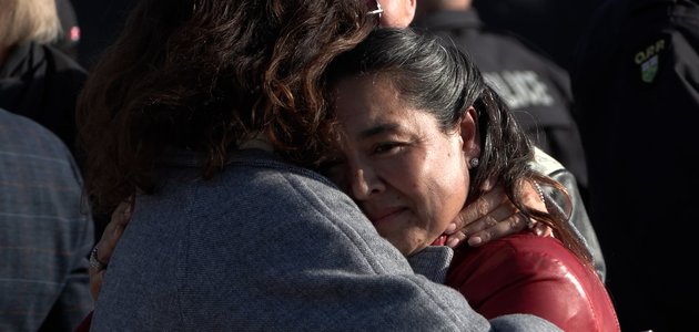 Two people hug