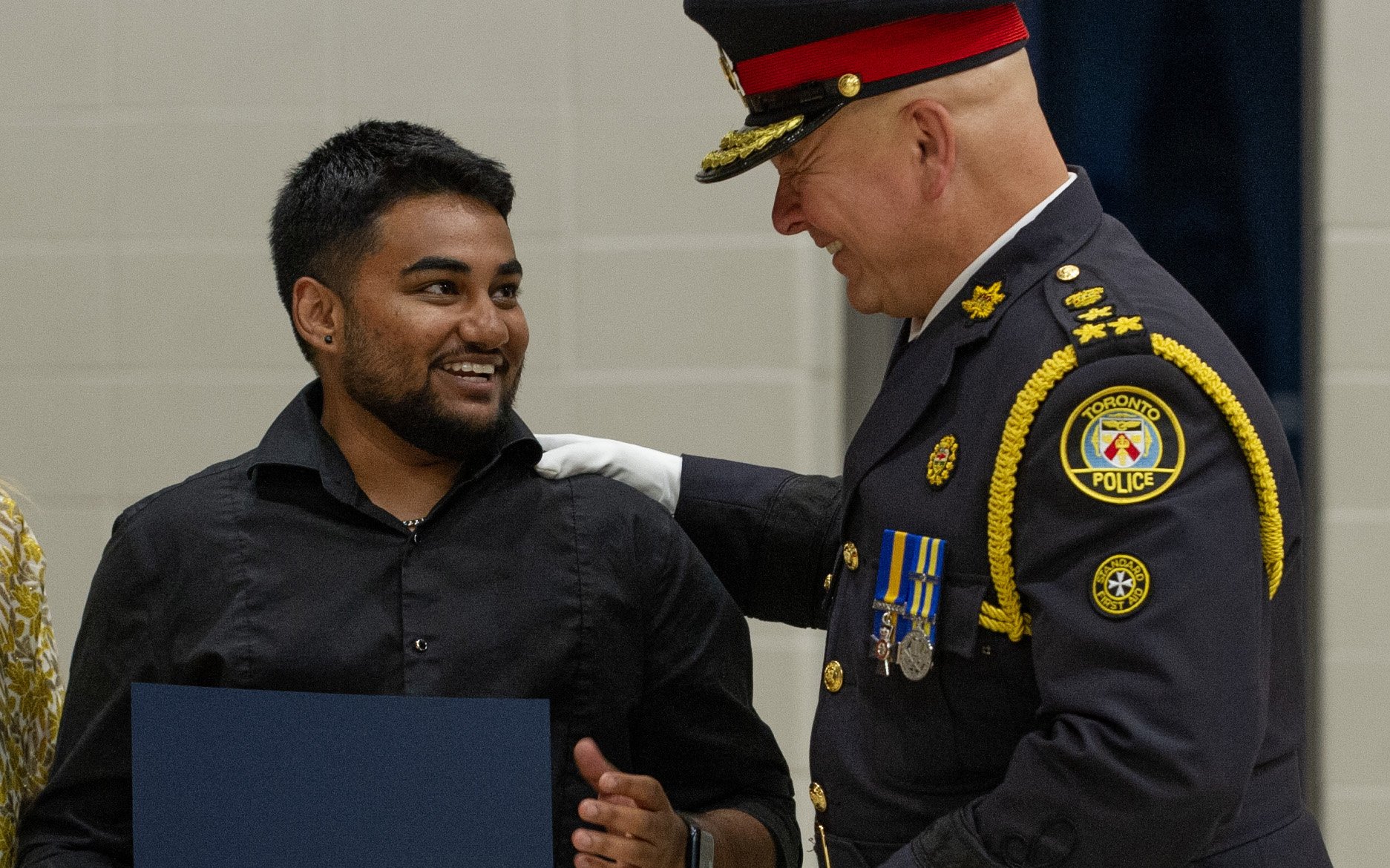 Police officer congratulates a person