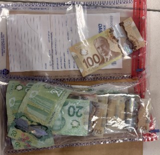 Man Arrested in Firearm Investigation,
Queen Street West and Denison Avenue,
Seized Items
