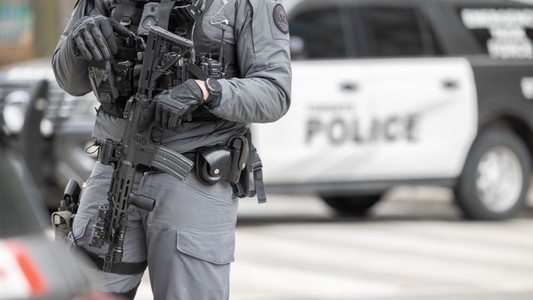 Police officer with police vehicle.